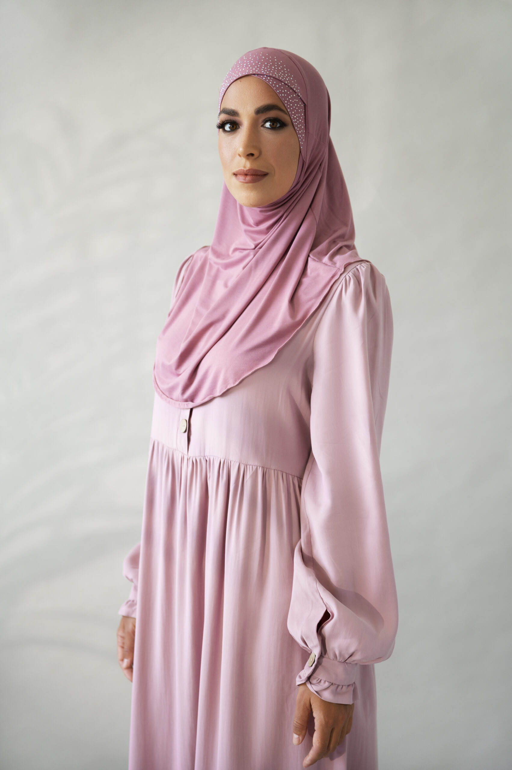 woman-posing-with-pink-hijab-side-view